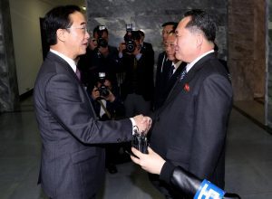 South Korean Unification Minister Cho Myoung-gyon is greeted by his North Korean counterpart Ri Son Gwon as he arrives for their meeting at the truce village of Panmunjom