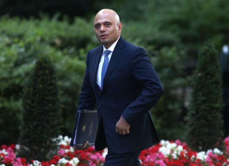 Britain’s Home Secretary Sajid Javid arrives at 10 Downing Street in London